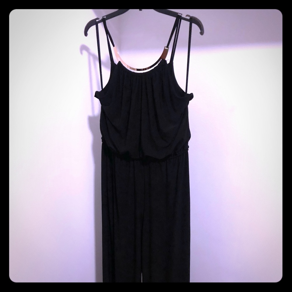 Black full length romper. Gold neck feature.